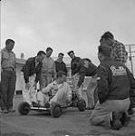 Stock Car Story. Go-carts are the craze at the Winnipeg Roadster Stock Car Racing Club grounds. These one cylinder cars can do 40 mph on their 2 1/2 hp motor. They cost approximately $150.00 September 1959.