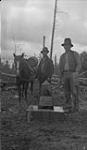 Marcus Platz, monument builder (left) and Harold Clutton at Monument 73-7. Alberta-BC boundary survey 1919