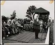 [Hon. James N. Allan addressing crowd at the Six Nations Fair near Brantford, Ont., on the occasion of his investiture as an honourary Chief.] [between 1958-1962].
