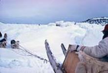 Over ice barrier, dog team [between 1961-1968]