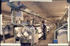 Man working machine - Dominion Textile Company [graphic material] [ca. 1988].