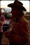[First Nations man holding a pipe] July 1972