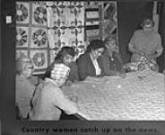 [Six women of the Women's Guild of St. Peters' church finishing a quilt]. Original title: Country women catch up on the news 9 March 1961