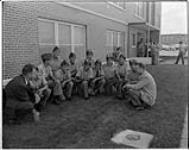 [First Nations Royal Canadian Air Force (RCAF) cadets enjoy a chat with camp councillors] 1964