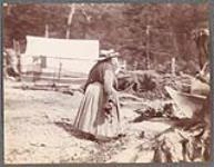 [A woman in a hat, carrying something to a canoe]. Original title: Noon [between 1889-1942]
