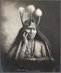 [Studio portrait of Stene-Tu, Tlingit, in clothing worn for potlatch ceremony]. Original title: Chilkat maiden 1906