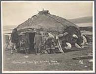 [Inuit family outside of skin tent, Kuliutschit, Siberia]. Original title: Eskimos and their igloo Koliutschit Siberia [between 1889-1942].