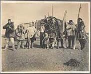 [Whalen Inuit Community, Inuit and non-Inuit men holding tools and weapons, Siberia] [between 1889-1942]
