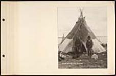 [First Nation woman and man with group of dogs in front of a tipi by the water] [ca. 1870-1910]
