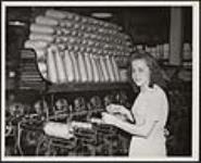 Rita Brown using universal tube winder September 14, 1942