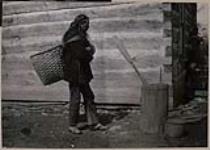 [William Styres carrying a pack basket on his back] 1912