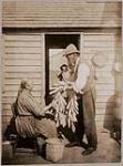 [Mr. and Mrs. Pete John with braided flint corn, for corn split ash baskets] 1913