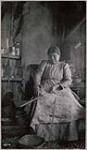 [Mrs. Simon Bumberry scrapping ash splints for ash basket] 1912