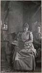 [Mrs. Simon Bumberry beginning to weaving split ash basket] 1912