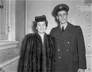 S/L M.E. Jowsey, a pilot in the Royal Canadian Air Force, is shown here with his mother, Mrs. H.B. Jowsey, immediately after he received the Distinguished Flying Cross at an investiture at Government House, Ottawa 28 February 1946.