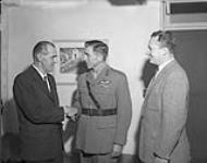 Presentation of Wings to Col. Deane-Freeman. Left to right, Maj.-Gen. Bernatchez, Col. Deane-Freeman, and Capt. L.M. Rodenbush May 1963.
