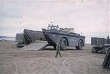 [Military tank unloading supplies] 1956