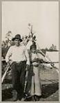 [Anishinaabe man and girl standing outside] 1920