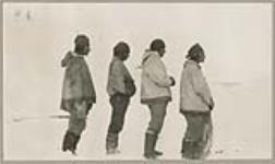 [Four Innu men at Emish (Voisey's Bay) identified from left to right as Nabée one; Peeuju naweeone; Steamish; Pukwee] [between 1921-1922]