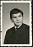 [Studio portrait of Elmer Derrick in a graduation gown] [ca. 1950-1960]