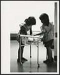 [Children playing with a water table at school] [ca. 1960-1980]