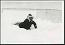 [Child playing in the snow] [ca. 1970-1980]