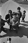 [Six children pose for a camera, Adrian Paul, Clayton Christmas, Brian Christmas, Charlene Christmas, Membertou, Nova Scotia] [Membertou (?) Mi'kmaq] [ca. 1969].