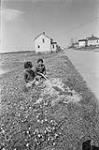 [Paula Sevestre (nee Christmas) and Lance Paul, sit on a lawn, Mi'kmaq Reserve, Millbrook] [ca. 1969].