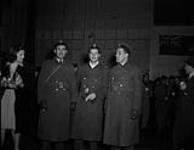 RCAF photo shows three men recently repatriated to Canada in February 1945 - F/O J.A. Deslauriers, F/O H.R. Willis-O'Connor and F/O F. Durrant February 1945.