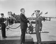 Minister of National Defence Claxton presenting J.D. Siddley Trophy to F/C R.B. Ingall, of Montreal, during first NATO pilots wings parade, Centralia 18 May 1951.