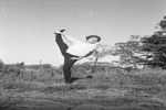 E. Lazar - fashion shots [Woman performing standing splits] Sept. 1961.