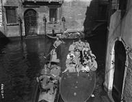 A party of "City of Windsor" squadron pilots, with their dates for the day, start off in their water taxi for a sightseeing tour of Venice, which is conveniently near the airfield where they finished the Italian campaign May 1945