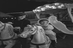[Doreen Lindsay and Andrea Szilasi riding a carousel] October 1967