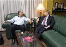 [Prime Minister Stephen Harper and Jamaica's Prime Minister Bruce Golding chat before holding a joint news conference at Sangster International Airport after a would-be hijacker surrendered in Montego Bay, Jamaica] 20 April 2009