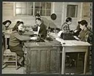 Administrative routine is handled in the camp Commission offices by second-generation Japanese [1943/11-1943/12]