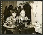 In many Japanese evacuees homes, the Security Commission has provided conveniences like this sewing machine [1943/11-1943/12]