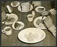 Camp No. 11 men get the standard lumber camp food: steaks, beans, pies, sauces, etc [1943/11-1943/12]