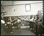 The fencing equipment was imported in pre-war days, from Japan, for these boys [1943/11-1943/12]