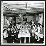 In the recreation room of the New Denver school teen-agers enjoy their graduation banquet [1945/06/16-1945/06/28]