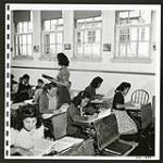 White and Japanese boys and girls sit side by side in these Picture Butte classrooms. [1/2] [1945/06/16-1945/06/28]
