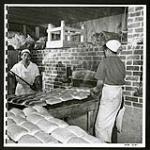 Mass production methods are used in the bakery at Tashme. [2/2] [1945/06/16-1945/06/28]