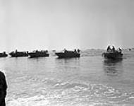 A Canadian Division stages invasion landing - The "R" Boats were on hand, as the Canadians staged their invasion, and they "ride" right up to the beach ca. July - Aug. 1943
