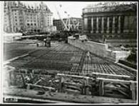 [Progress shot of Plaza Bridge expansion covered in rebar facing east] October 13, 1938 