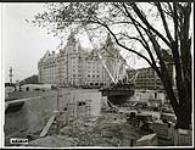 [View of Plaza Bridge expansion with crane and Chateau Laurier in background] October 13, 1938 