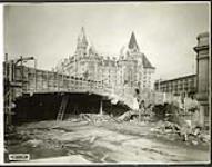 [View of wooden framing around Plaza Bridge expansion from the Rideau Canal driveway] November 10, 1938
