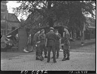 [Group of British and Canadian officers conferring en route to Utrecht, Netherlands, 7 May 1945. Group includes Brigadiers Murphy and Wood, and Majors Davidson and Carley.] 07 May 1945.