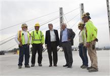 [Prime Minister Stephen Harper and British Columbia Premier Gordon Campbell talk with workers on the Pitt River Bridge in Pitt Meadows, British Columbia] 4 August 2009