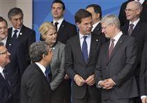 [Prime Minister Stephen Harper chats with fellow leaders during a photo with participants of the meeting on Afghanistan at the North Atlantic Treaty Organization (NATO) Summit in Newport, Wales] 4 September 2014