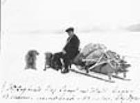 [Man sitting on edge of dog sled] [graphic material] [ca. 1890]
