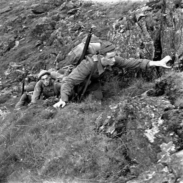 Unidentified infantrymen of the 1st Canadian Infantry Division taking part in a training exercise, Britain, May 1943.